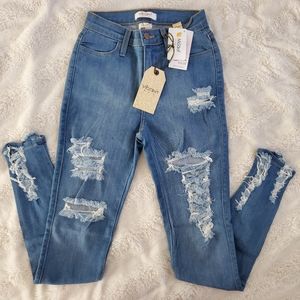 HIGH RISE MEDIUM DENIM JEANS SIZE 5/W26 STRETCH DISTRESSED.